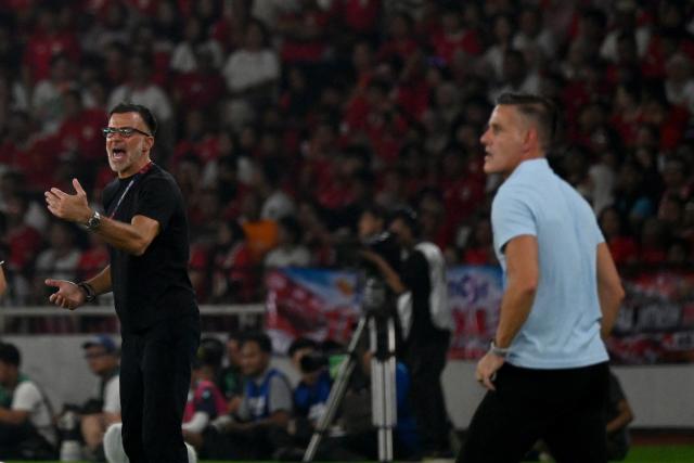 (261005) -- JAKARTA, Oct. 5, 2026 (Xinhua) -- Anthony Hudson (L), head coach of Thailand, reacts during the FIFA ASEAN Cup 2026 Division 1 Final Match between Indonesia and Thailand at Gelora Bung Karno Stadium in Jakarta, Indonesia, Oct. 5, 2026. (Xinhua/Agung Kuncahya B.)