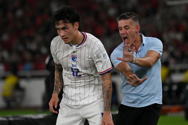 (261005) -- JAKARTA, Oct. 5, 2026 (Xinhua) -- John Herdman (R), head coach of Indonesia, reacts during the FIFA ASEAN Cup 2026 Division 1 Final Match between Indonesia and Thailand at Gelora Bung Karno Stadium in Jakarta, Indonesia, Oct. 5, 2026. (Xinhua/Agung Kuncahya B.)