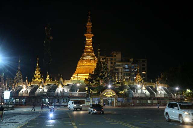 (261005) -- YANGON, Oct. 5, 2026 (Xinhua) -- This photo taken on Oct. 5, 2026 shows a night view of the Sule Pagoda in downtown Yangon, Myanmar. Myanmar has begun rotational power distribution to balance electricity consumption with available generation capacity amid rising demand ahead of the looming dry season, according to the Ministry of Electricity and Energy. (Xinhua/Myo Kyaw Soe)