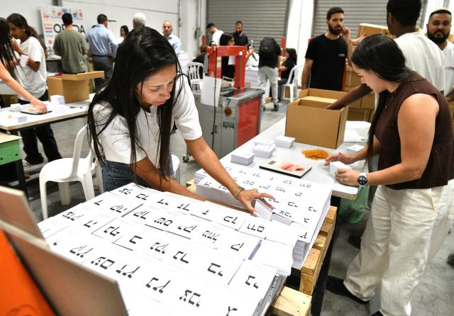 (261005) -- JERUSALEM, Oct. 5, 2026 (Xinhua) -- Workers arrange newly produced ballot papers at a printing factory in Kiryat Gat, Israel, in preparation for Israel's upcoming general elections, Oct. 5, 2026. The general elections for Israel's Knesset, the country's parliament, will be held on Oct. 27. (JINI via Xinhua)