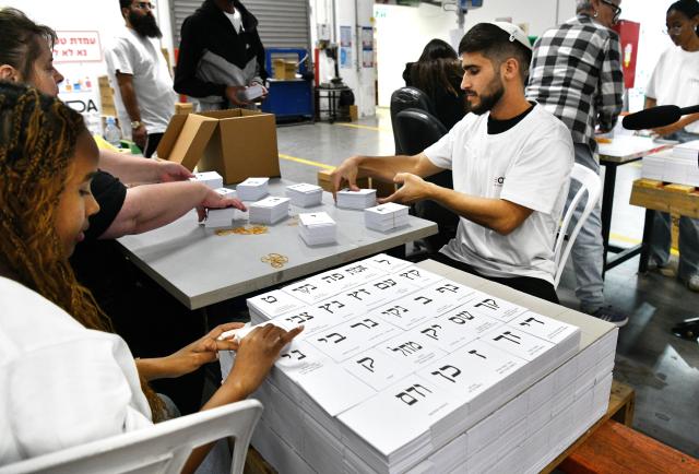 (261005) -- JERUSALEM, Oct. 5, 2026 (Xinhua) -- Workers arrange newly produced ballot papers at a printing factory in Kiryat Gat, Israel, in preparation for Israel's upcoming general elections, Oct. 5, 2026. The general elections for Israel's Knesset, the country's parliament, will be held on Oct. 27. (JINI via Xinhua)
