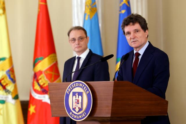 (261005) -- BUCHAREST, Oct. 5, 2026 (Xinhua) -- Romanian President Nicusor Dan (R) speaks at a press conference in Bucharest, Romania, Oct. 5, 2026. Nicusor Dan designated Luca Niculescu, state secretary at the Ministry of Foreign Affairs, to form the government on Monday evening, according to Romania's national news agency Agerpres. (Photo by Cristian Cristel/Xinhua)