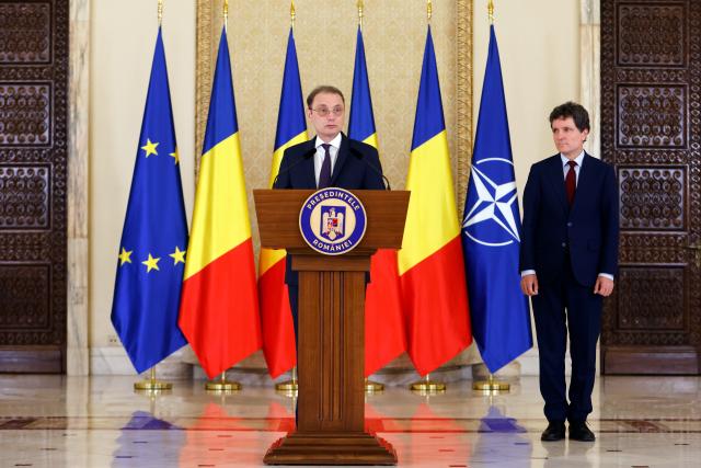 (261005) -- BUCHAREST, Oct. 5, 2026 (Xinhua) -- Luca Niculescu (L) speaks at a press conference in Bucharest, Romania, Oct. 5, 2026. Romanian President Nicusor Dan designated Luca Niculescu, state secretary at the Ministry of Foreign Affairs, to form the government on Monday evening, according to Romania's national news agency Agerpres. (Photo by Cristian Cristel/Xinhua)