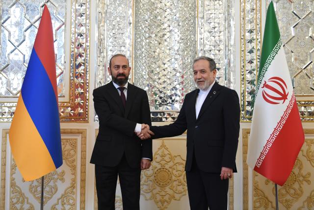 (261005) -- TEHRAN, Oct. 5, 2026 (Xinhua) -- Iranian Foreign Minister Seyed Abbas Araghchi (R) shakes hands with visiting Armenian Foreign Minister Ararat Mirzoyan in Tehran, Iran, Oct. 5, 2026. (Xinhua/Shadati)