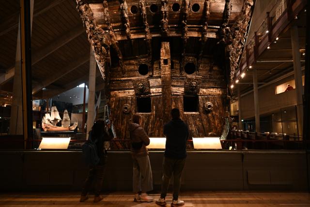 (261006) -- STOCKHOLM, Oct. 6, 2026 (Xinhua) -- Visitors tour the Vasa Museum in Stockholm, Sweden, on Oct. 5, 2026. The Vasa Museum in Stockholm, Sweden, features the 17th-century warship Vasa as its centerpiece. Through the ship, artifacts and themed exhibitions, the museum tells the story of the vessel's construction, sinking and salvage. The Vasa sank on its maiden voyage in 1628 and was salvaged more than 300 years later. It is one of the best-preserved 17th-century ships in the world. (Xinhua/Lyu You)
