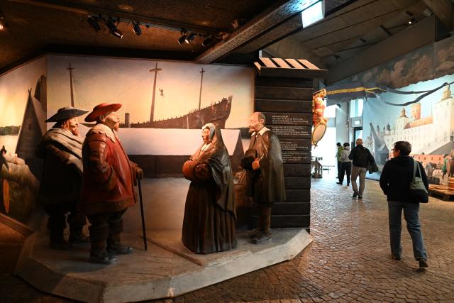 (261006) -- STOCKHOLM, Oct. 6, 2026 (Xinhua) -- This photo taken on Oct. 5, 2026 shows an exhibition area featuring sculptures and a reconstructed scene at the Vasa Museum in Stockholm, Sweden. The Vasa Museum in Stockholm, Sweden, features the 17th-century warship Vasa as its centerpiece. Through the ship, artifacts and themed exhibitions, the museum tells the story of the vessel's construction, sinking and salvage. The Vasa sank on its maiden voyage in 1628 and was salvaged more than 300 years later. It is one of the best-preserved 17th-century ships in the world. (Xinhua/Lyu You)