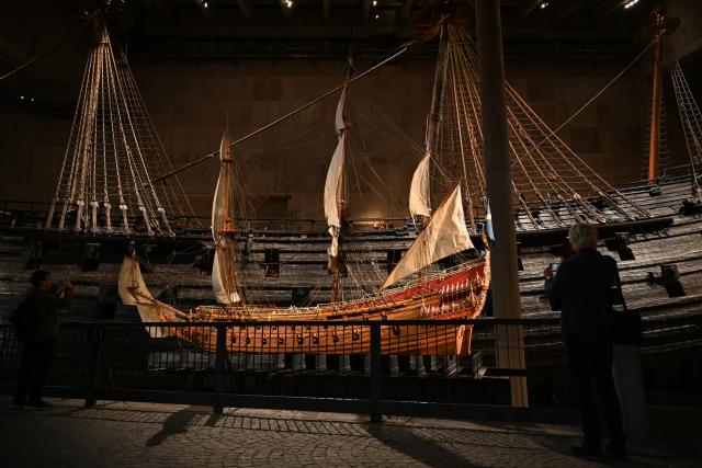 (261006) -- STOCKHOLM, Oct. 6, 2026 (Xinhua) -- Visitors take photos of a reconstruction model of the warship Vasa at the Vasa Museum in Stockholm, Sweden, on Oct. 5, 2026. The Vasa Museum in Stockholm, Sweden, features the 17th-century warship Vasa as its centerpiece. Through the ship, artifacts and themed exhibitions, the museum tells the story of the vessel's construction, sinking and salvage. The Vasa sank on its maiden voyage in 1628 and was salvaged more than 300 years later. It is one of the best-preserved 17th-century ships in the world. (Xinhua/Lyu You)