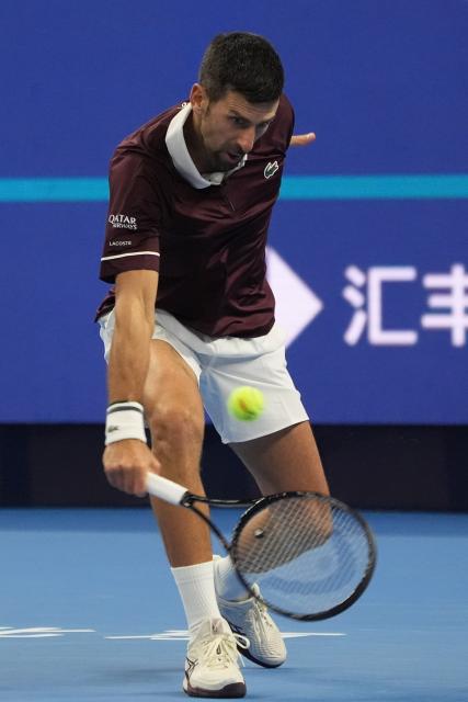 (261006) -- BEIJING, Oct. 6, 2026 (Xinhua) -- Novak Djokovic competes during the men's singles semifinal match between Daniil Medvedev of Russia and Novak Djokovic of Serbia at 2026 China Open tennis tournament in Beijing, China, Oct. 5, 2026. (Xinhua/Xie Han)