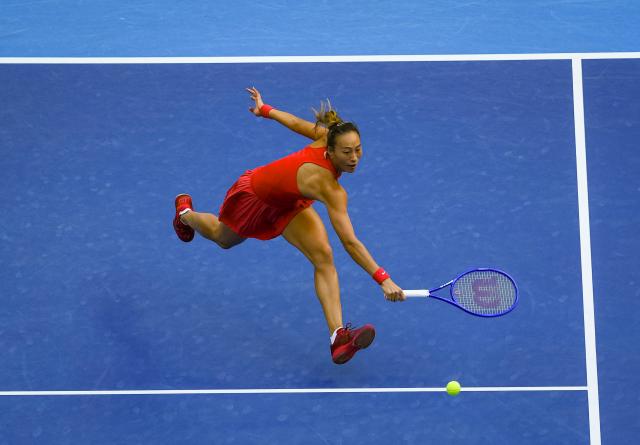 (261006) -- BEIJING, Oct. 6, 2026 (Xinhua) -- Zheng Qinwen of China hits a return during the women's singles round of 32 match against Marie Bouzkova of the Czech Republic at 2026 China Open tennis tournament in Beijing, China, Oct. 5, 2026. (Xinhua/Sun Fei)