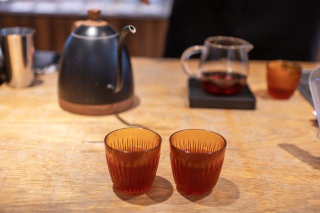 (261006) -- KUALA LUMPUR, Oct. 6, 2026 (Xinhua) -- Thomas Ooi, founder of Ghostbird Coffee Roastery, demonstrates the finished product of his pour-over coffee in Kuala Lumpur, Malaysia, Sept. 29, 2026. Southwest China's Yunnan Province sits on the northern fringe of the global coffee-growing "bean belt" between the Tropics of Cancer and Capricorn. For centuries its rolling highlands were celebrated foremost as China's tea heartland. Over the past two decades, steady investment, improved farming techniques and booming domestic consumption have nurtured a thriving home-grown coffee industry.
   Malaysia is among Yunnan's key Asian export destinations. According to Yunnan's international trade association, Yunnan coffee was exported to 43 countries and regions in 2025. European and Asian countries are the leading destinations for Yunnan's coffee shipments. Within Asia, Vietnam and Malaysia stand as the two major markets. (Photo by Chong Voon Chung/Xinhua)