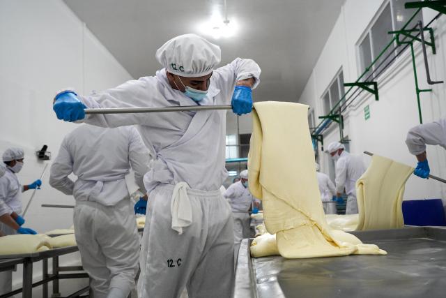 (261006) -- CHONTALES, Oct. 6, 2026 (Xinhua) -- Workers produce cheese at a dairy factory in Santo Tomas, Chontales, Nicaragua, Sept. 26, 2026. Chontales is a department in south-central Nicaragua and is one of the country's traditional agricultural and livestock-producing regions. The area has a well-developed cattle-raising sector, which has also supported the development of related industries, particularly dairy processing. (Xinhua/Li Jiaxu)