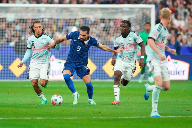 (261006) -- PARIS, Oct. 6, 2026 (Xinhua) -- France's Rayan Cherki (2nd L) vies with Belgium's Diego Moreira (1st L) and Romeo Lavia during the UEFA Nations League 2026/27 League A Group A1 match between France and Belgium in Paris, France, Oct. 5, 2026. (Photo by Henri Szwarc/Xinhua)