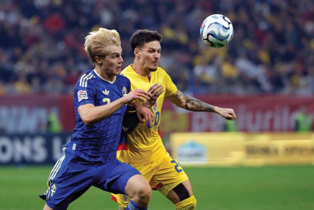 (261006) -- BUCHAREST, Oct. 6, 2026 (Xinhua) -- Romania's Dennis Man (R) vies with Sweden's Lucas Bergvall during the UEFA Nations League 2026/27 League B Group B4 match between Romania and Sweden in Bucharest, Romania, Oct. 5, 2026. (Photo by Cristian Cristel/Xinhua)