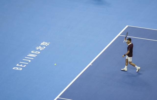(261006) -- BEIJING, Oct. 6, 2026 (Xinhua) -- Novak Djokovic of Serbia waves to spectators during the men's singles final match against Alex de Minaur of Australia at 2026 China Open tennis tournament in Beijing, China, Oct. 6, 2026. (Xinhua/Bai Xuefei)