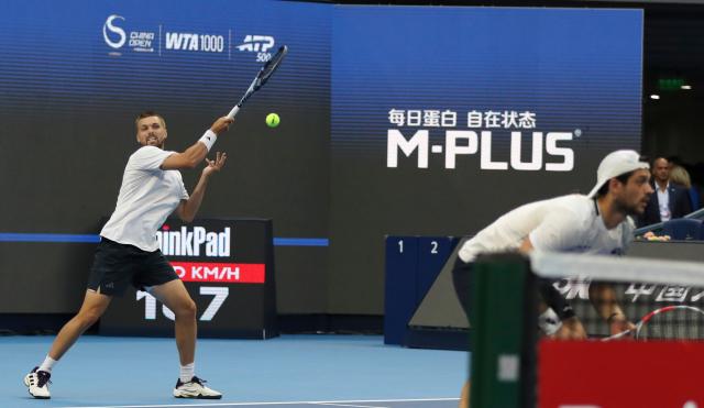 (261006) -- BEIJING, Oct. 6, 2026 (Xinhua) -- Julian Cash/Lloyd Glasspool (L) of Britain compete during the men's doubles final match against Sander Arends/David Pel of the Netherlands at 2026 China Open tennis tournament in Beijing, China, Oct. 6, 2026. (Photo by Ma Zihan/Xinhua)