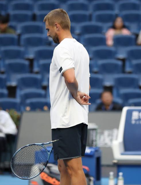 (261006) -- BEIJING, Oct. 6, 2026 (Xinhua) -- Julian Cash of Britain gestures to Lloyd Glasspool of Britain during the men's doubles final match against Sander Arends/David Pel of the Netherlands at 2026 China Open tennis tournament in Beijing, China, Oct. 6, 2026. (Photo by Ma Zihan/Xinhua)