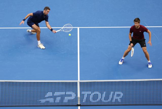 (261006) -- BEIJING, Oct. 6, 2026 (Xinhua) -- Sander Arends/David Pel (L) of the Netherlands compete during the men's doubles final match against Julian Cash/Lloyd Glasspool of Britain at 2026 China Open tennis tournament in Beijing, China, Oct. 6, 2026. (Xinhua/Zhang Chenlin)