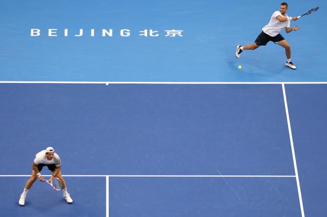(261006) -- BEIJING, Oct. 6, 2026 (Xinhua) -- Julian Cash/Lloyd Glasspool (R) of Britain compete during the men's doubles final match against Sander Arends/David Pel of the Netherlands at 2026 China Open tennis tournament in Beijing, China, Oct. 6, 2026. (Xinhua/Zhang Chenlin)