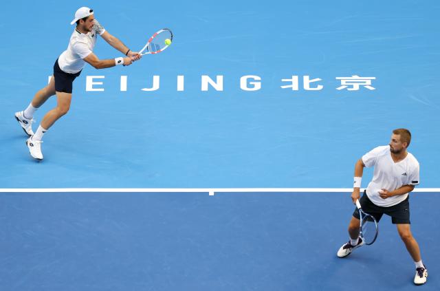 (261006) -- BEIJING, Oct. 6, 2026 (Xinhua) -- Julian Cash (L)/Lloyd Glasspool of Britain compete during the men's doubles final match against Sander Arends/David Pel of the Netherlands at 2026 China Open tennis tournament in Beijing, China, Oct. 6, 2026. (Xinhua/Zhang Chenlin)