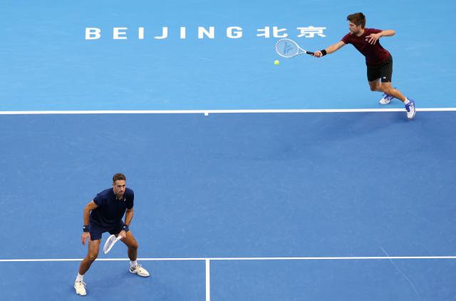 (261006) -- BEIJING, Oct. 6, 2026 (Xinhua) -- Sander Arends (R)/David Pel of the Netherlands compete during the men's doubles final match against Julian Cash/Lloyd Glasspool of Britain at 2026 China Open tennis tournament in Beijing, China, Oct. 6, 2026. (Xinhua/Zhang Chenlin)