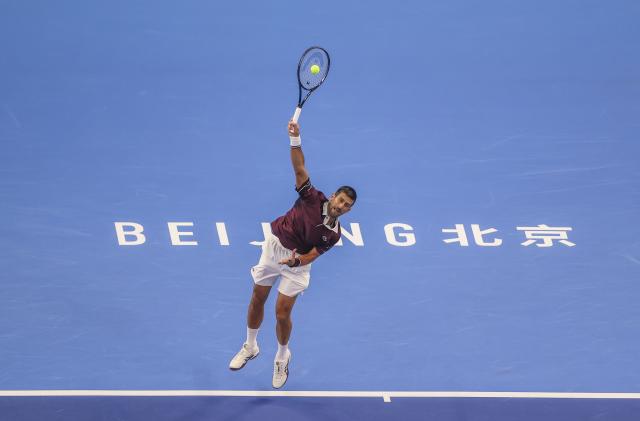 (261006) -- BEIJING, Oct. 6, 2026 (Xinhua) -- Novak Djokovic of Serbia serves during the men's singles final match against Alex de Minaur of Australia at 2026 China Open tennis tournament in Beijing, China, Oct. 6, 2026. (Photo by Ma Zihan/Xinhua)
