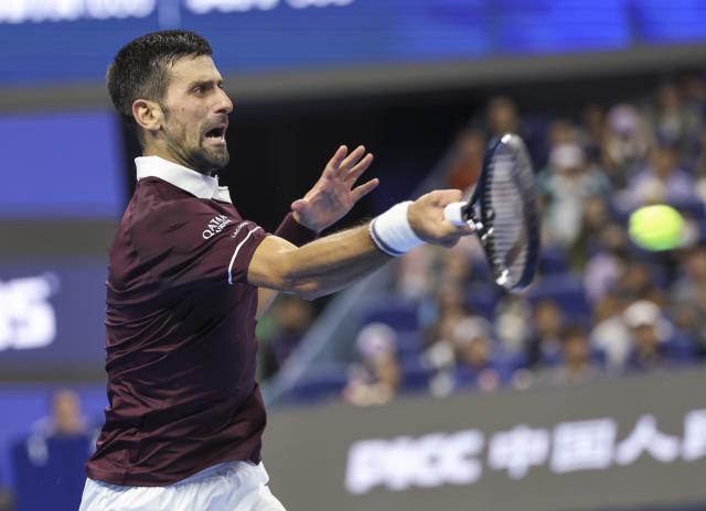 (261006) -- BEIJING, Oct. 6, 2026 (Xinhua) -- Novak Djokovic of Serbia hits a return during the men's singles final match against Alex de Minaur of Australia at 2026 China Open tennis tournament in Beijing, China, Oct. 6, 2026. (Xinhua/Bai Xuefei)