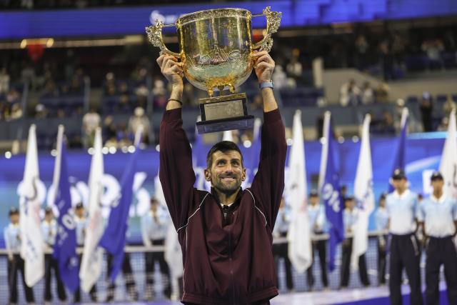 (261006) -- BEIJING, Oct. 6, 2026 (Xinhua) -- Novak Djokovic of Serbia holds up the champion trophy during the awarding ceremony for the men's singles final at 2026 China Open tennis tournament in Beijing, China, Oct. 6, 2026. (Xinhua/Bai Xuefei)