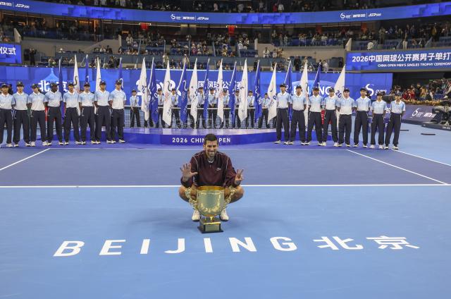 (261006) -- BEIJING, Oct. 6, 2026 (Xinhua) -- Novak Djokovic of Serbia poses with his champion trophy during the awarding ceremony for the men's singles final at 2026 China Open tennis tournament in Beijing, China, Oct. 6, 2026. (Xinhua/Bai Xuefei)