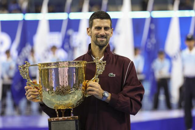 (261006) -- BEIJING, Oct. 6, 2026 (Xinhua) -- Novak Djokovic of Serbia poses with his champion trophy during the awarding ceremony for the men's singles final at 2026 China Open tennis tournament in Beijing, China, Oct. 6, 2026. (Xinhua/Bai Xuefei)