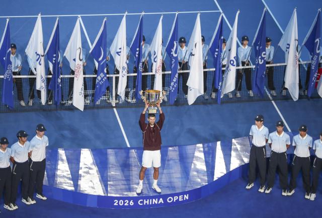 (261006) -- BEIJING, Oct. 6, 2026 (Xinhua) -- Novak Djokovic of Serbia holds up the champion trophy during the awarding ceremony for the men's singles final at 2026 China Open tennis tournament in Beijing, China, Oct. 6, 2026. (Photo by Ma Zihan/Xinhua)
