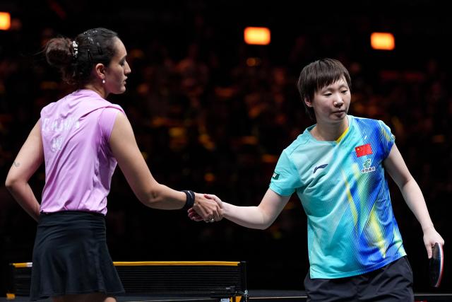 (261006) -- BEIJING, Oct. 6, 2026 (Xinhua) -- Wang Manyu (R) of China shakes hands with Manika Batra of India after the women's singles round of 32 match at 2025 World Table Tennis (WTT) China Smash in Beijing, China, Oct. 6, 2026. (Xinhua/Xie Han)