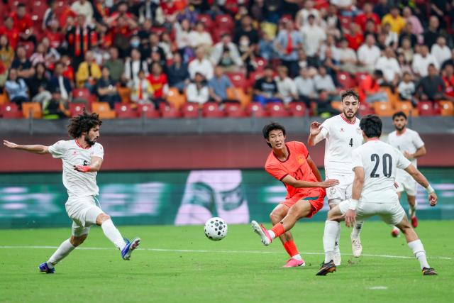 (261006) -- CHONGQING, Oct. 6, 2026 (Xinhua) -- Zhao Songyuan (4th R) of China shoots during the CFA Team China International Football Competitions Chongqing 2026 between China and Tajikistan in Chongqing, Oct. 6, 2026. (Xinhua/Huang Wei)
