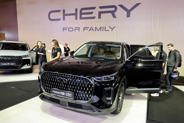 (261006) -- BUCHAREST, Oct. 6, 2026 (Xinhua) -- Visitors look at a car model produced by Chinese producer Chery during the first day of Bucharest Auto Show & Accessories in Bucharest, Romania, Oct. 6, 2026. (Photo by Cristian Cristel/Xinhua)