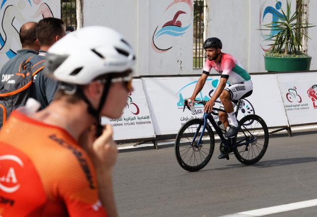 (261007) -- ALGIERS, Oct. 7, 2026 (Xinhua) -- A cyclist reacts before the second stage of the 19th Algiers International Cycling Grand Prix in Algiers, Algeria, on Oct. 6, 2026. (Photo by Billel Bensalem/Xinhua)