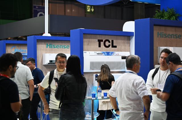(261007) -- RIO DE JANEIRO, Oct. 7, 2026 (Xinhua) -- This photo taken on Oct. 6, 2026 shows the exhibition area of some Chinese brands during the FEBRAVA Rio at the Riocentro convention and event center in Rio de Janeiro, Brazil. The three-day FEBRAVA Rio (Portuguese short for International Fair of Refrigeration, Air Conditioning, Ventilation, Heating, Air and Water Treatment) kicked off here on Tuesday. Some Chinese brands showcased their latest products during the fair, drawing great attention from visitors. (Xinhua/Jin Haoyuan)