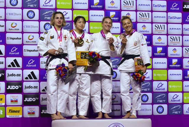 (261007) -- BAKU, Oct. 7, 2026 (Xinhua) -- (L to R) Silver medalist Eteri Liparteliani of Georgia, gold medalist Omori Akari of Japan, bronze medalists Ana Viktorija Puljiz of Croatia and Marica Perisic of Serbia pose for a group photo on the podium for the women's -57 kg event at the 2026 World Senior Judo Championships in Baku on Oct. 6, 2026. (Xinhua/Chen Junfeng)