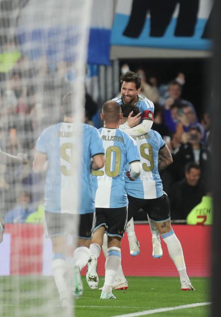 (261007) -- BUENOS AIRES, Oct. 7, 2026 (Xinhua) -- Lionel Messi (top) of Argentina celebrates with his teammates after scoring during a football friendly match between Argentina and Benin at the Monumental Stadium in Buenos Aires, capital of Argentina, on Oct. 6, 2026. The match marked Lionel Messi's final appearance for the Argentina national football team. (Photo by Martin Zabala/Xinhua)