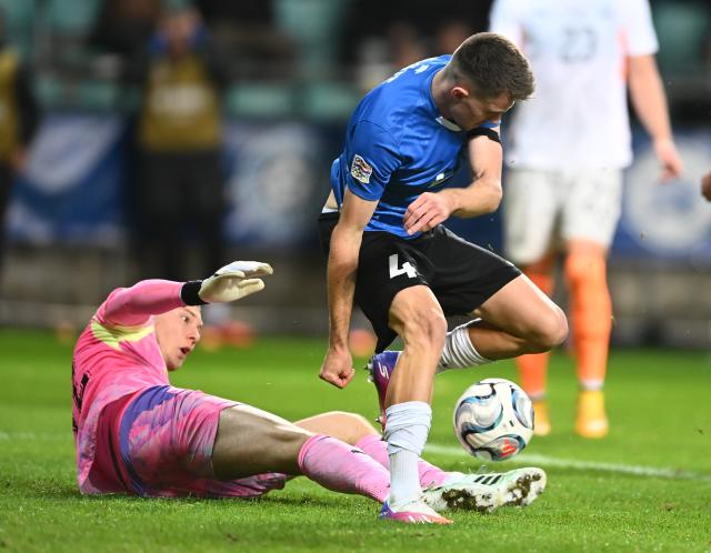 (261007) -- TALLINN, Oct. 7, 2026 (Xinhua) -- Iceland's goalkeeper Hakon Rafn Valdimarsson (L) challenges Estonia's Mattias Kait for the ball during the UEFA Nations League 2026/27 League C Group C4 match between Estonia and Iceland at A. Le Coq Arena in Tallinn, Estonia, Oct. 6, 2026. (Photo by Sergei Stepanov/Xinhua)