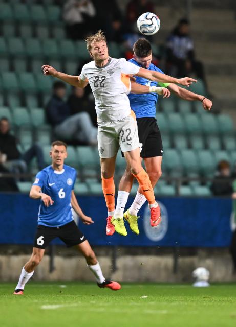 (261007) -- TALLINN, Oct. 7, 2026 (Xinhua) -- Iceland's Andri Gudjohnsen (top L) and Estonia's Maksim Paskotsi head for the ball during the UEFA Nations League 2026/27 League C Group C4 match between Estonia and Iceland at A. Le Coq Arena in Tallinn, Estonia, Oct. 6, 2026. (Photo by Sergei Stepanov/Xinhua)