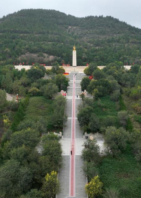 (261007) -- YAN'AN, Oct. 7, 2026 (Xinhua) -- An aerial drone photo taken on Sept. 26, 2026 shows a memorial park marking the victory of the Central Red Army's Long March in Wuqi County of Yan'an City, northwest China's Shaanxi Province. This year marks the 90th anniversary of the victory of the Long March. (Photo by Qi Xiaojun/Xinhua)