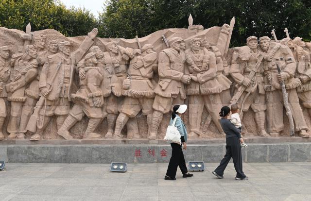 (261007) -- YAN'AN, Oct. 7, 2026 (Xinhua) -- Tourists visit a memorial park marking the victory of the Central Red Army's Long March in Wuqi County of Yan'an City, northwest China's Shaanxi Province, Sept. 26, 2026. This year marks the 90th anniversary of the victory of the Long March. (Photo by Qi Xiaojun/Xinhua)