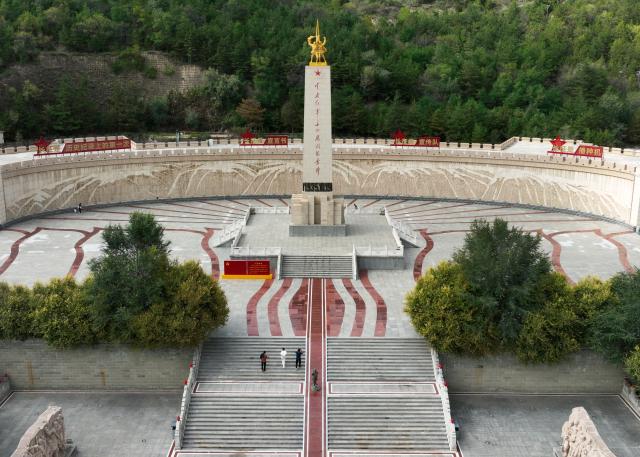 (261007) -- YAN'AN, Oct. 7, 2026 (Xinhua) -- The photo taken on Sept. 26, 2026 shows tourists visiting a memorial park marking the victory of the Central Red Army's Long March in Wuqi County of Yan'an City, northwest China's Shaanxi Province. This year marks the 90th anniversary of the victory of the Long March. (Photo by Qi Xiaojun/Xinhua)
