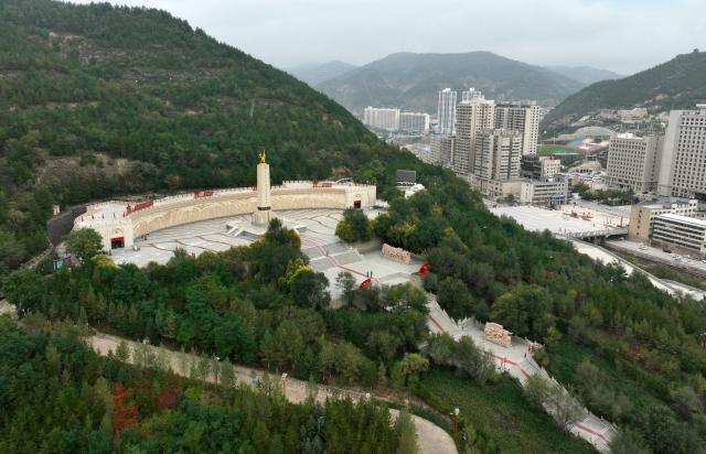 (261007) -- YAN'AN, Oct. 7, 2026 (Xinhua) -- An aerial drone photo taken on Sept. 26, 2026 shows a memorial park marking the victory of the Central Red Army's Long March in Wuqi County of Yan'an City, northwest China's Shaanxi Province. This year marks the 90th anniversary of the victory of the Long March. (Photo by Qi Xiaojun/Xinhua)