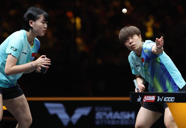(261007) -- BEIJING, Oct. 7, 2026 (Xinhua) -- Wang Yidi (R)/Jiang Yiyi of China compete during the women's doubles round of 16 match between Wang Yidi/Jiang Yiyi of China and Shin Yubin/Joo Cheonhui of South Korea at 2026 World Table Tennis (WTT) China Smash in Beijing, China, Oct. 7, 2026. (Xinhua/Zhang Chenlin)