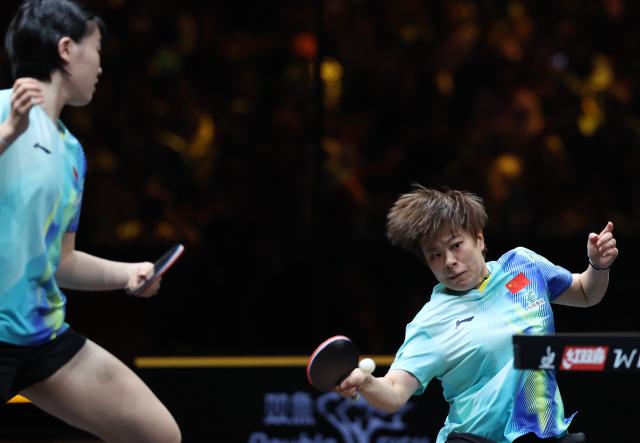 (261007) -- BEIJING, Oct. 7, 2026 (Xinhua) -- Wang Yidi (R)/Jiang Yiyi of China compete during the women's doubles round of 16 match between Wang Yidi/Jiang Yiyi of China and Shin Yubin/Joo Cheonhui of South Korea at 2026 World Table Tennis (WTT) China Smash in Beijing, China, Oct. 7, 2026. (Xinhua/Zhang Chenlin)