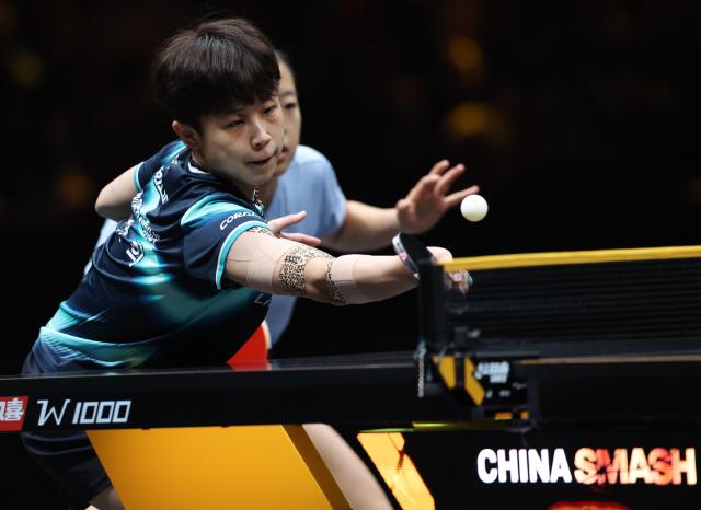 (261007) -- BEIJING, Oct. 7, 2026 (Xinhua) -- Shin Yubin/Joo Cheonhui (L) of South Korea compete during the women's doubles round of 16 match between Wang Yidi/Jiang Yiyi of China and Shin Yubin/Joo Cheonhui of South Korea at 2026 World Table Tennis (WTT) China Smash in Beijing, China, Oct. 7, 2026. (Xinhua/Zhang Chenlin)