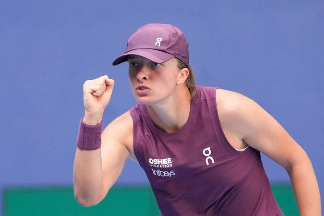 (261007) -- BEIJING, Oct. 7, 2026 (Xinhua) -- Iga Swiatek reacts during the women's singles fourth round match between Iga Swiatek of Poland and Iva Jovic of the United States at 2026 China Open tennis tournament in Beijing, China, Oct. 7, 2026. (Xinhua/Ju Huanzong)