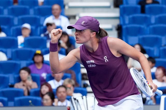 (261007) -- BEIJING, Oct. 7, 2026 (Xinhua) -- Iga Swiatek reacts during the women's singles fourth round match between Iga Swiatek of Poland and Iva Jovic of the United States at 2026 China Open tennis tournament in Beijing, China, Oct. 7, 2026. (Xinhua/Ju Huanzong)