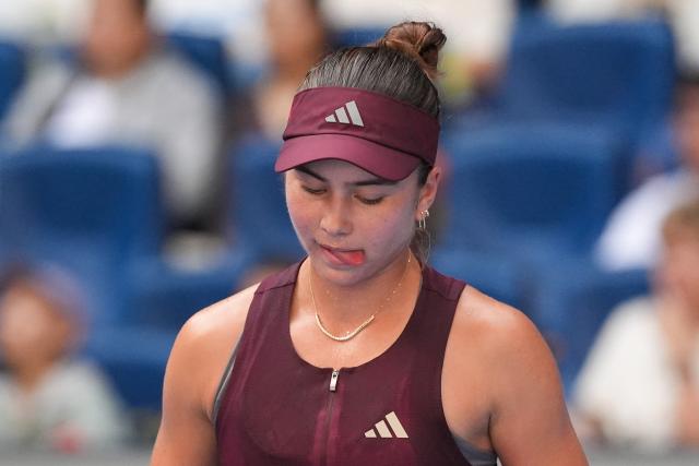 (261007) -- BEIJING, Oct. 7, 2026 (Xinhua) -- Iva Jovic reacts during the women's singles fourth round match between Iga Swiatek of Poland and Iva Jovic of the United States at 2026 China Open tennis tournament in Beijing, China, Oct. 7, 2026. (Xinhua/Ju Huanzong)