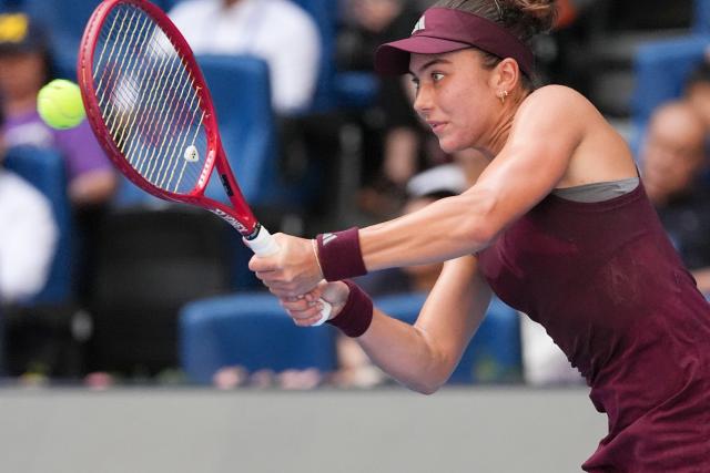 (261007) -- BEIJING, Oct. 7, 2026 (Xinhua) -- Iva Jovic hits a return during the women's singles fourth round match between Iga Swiatek of Poland and Iva Jovic of the United States at 2026 China Open tennis tournament in Beijing, China, Oct. 7, 2026. (Xinhua/Ju Huanzong)